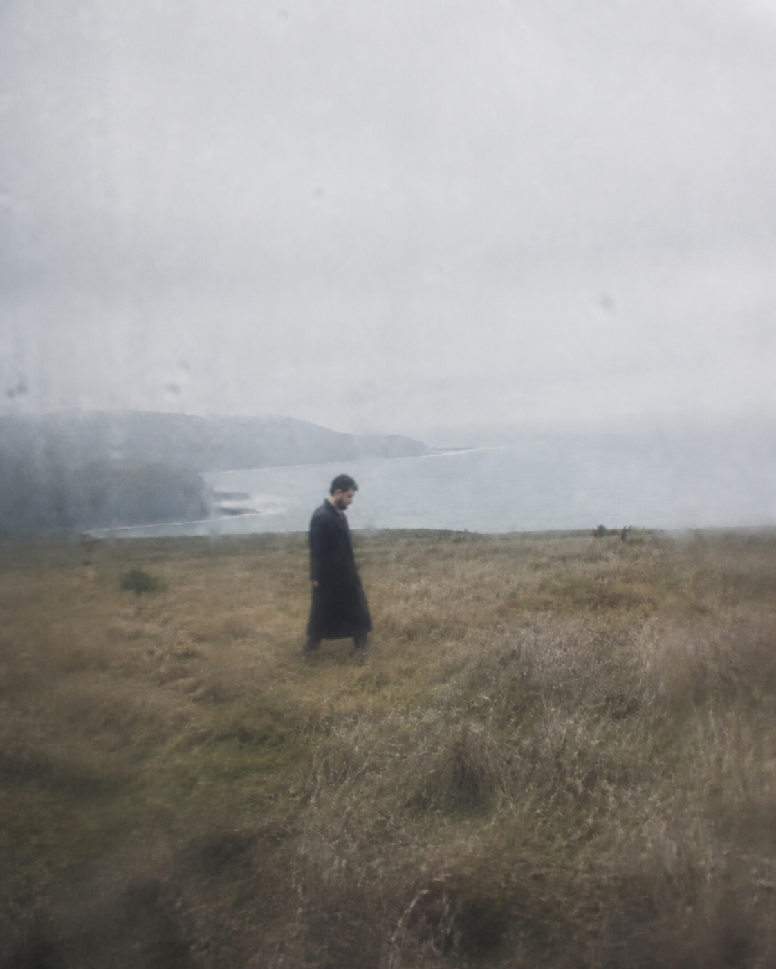 Daou walking through a rain softened coastal field